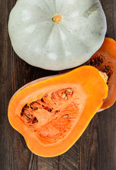 Cut pumpkin on a wooden table