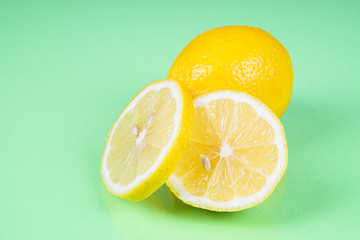 Lemon on green background