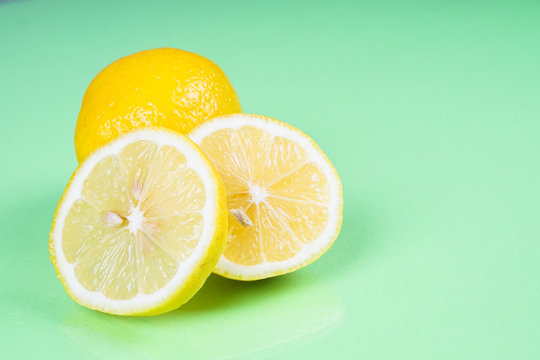Lemon on green background