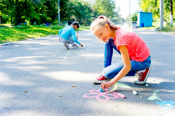 Kids drawing with chalk