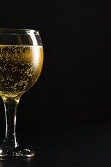 glass of champagne on black background