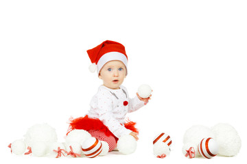 Beautiful funny baby in a Christmas hat isolated on white