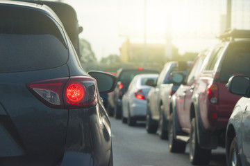 Cars on the road heading towards the goal of the trip. and stop by traffic jam.