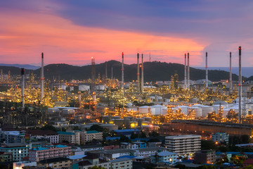 Aerial view Oil refinery with a background of mountains and sky.