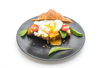 egg benedict with avocado, tomatoes and salad - healthy or vegan food style