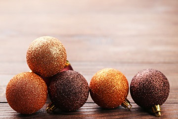 Christmas baubles on brown wooden table