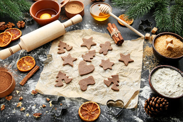 Baking christmas cookies on grey wooden table