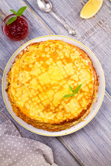 Stack of thin pancakes, crepes on white plate