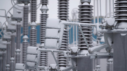 Switchgears and switches in a power plant with steel structure. Power plant detail, high voltage isolation. Voltage transformers at the power plant