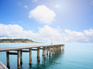 Wooden bridge in the blue sea and blue sky landscape in Thailand