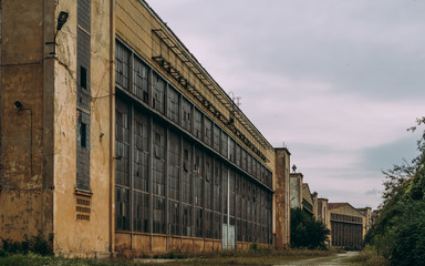 Fototapeta na wymiar Abandoned Factory Exterior Industry