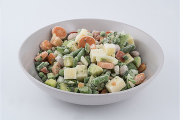 various frozen vegetables cut on a plate	