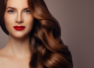 Beautiful Redhead Woman Fashion Model with Perfect Wavy Hairstyle and Makeup, Pretty Female Face...