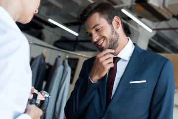 businessman and seller in boutique