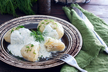 Traditional Lithuanian dish meal cuisine - stuffed meat potato dumpling (Cepelinai,didzkukuliai),most popular Lithuanian national dish, curd, similar to polish © Анна Журавлева