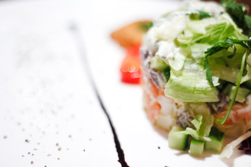 Delicious salad with chicken, nuts, egg and vegetables. .