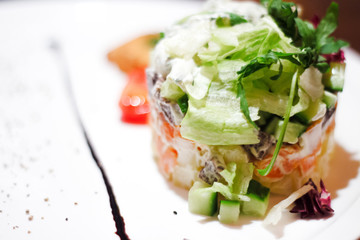 Plate with chicken salad on white .