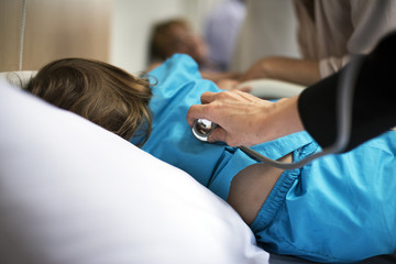 Young sick girl is staying at the hospital