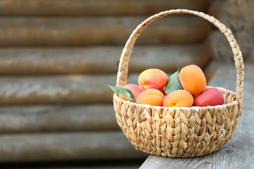 Juicy apricots in basket outdoor