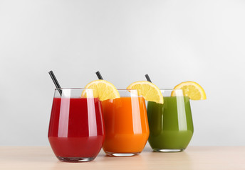 Glasses with various fresh juices on table