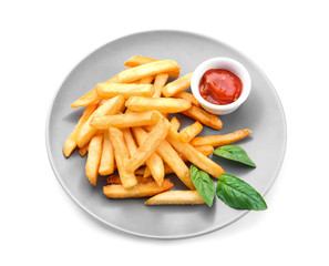 Plate with yummy french fries and sauce on white background