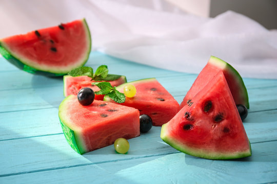 Tasty sliced watermelon on table