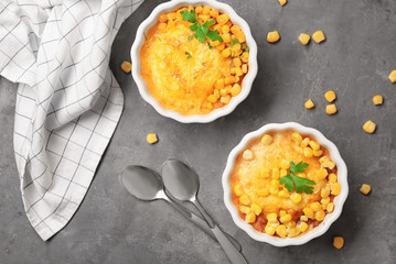 Ramekins with corn pudding on table