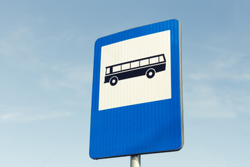 Bus station road sign on blue sky