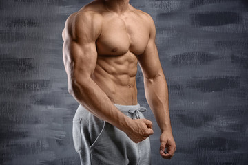 Muscular man on dark background