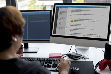 Female working on a desktop computer