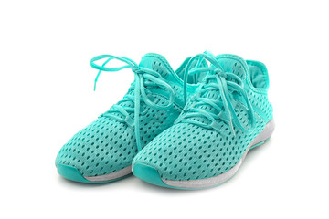 Pair of tennis shoes on white background