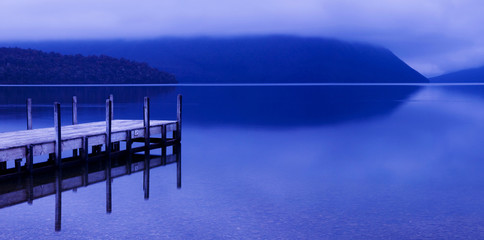 Tranquil peaceful lake with jetty, New Zealand.