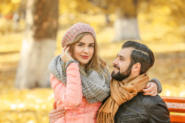 Fototapeta premium Young couple in park on autumn day