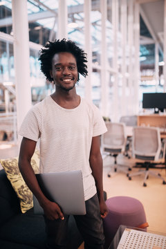Portrait of smiling confident afro american adult in the office