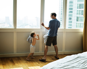 Father and son play fighting