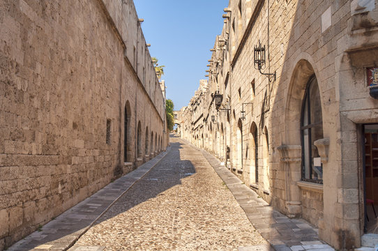 Fototapeta Old castle architecture building street with big wall in Rhodes Greek town