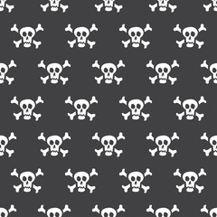Seamless pattern white skulls with bones on a black background