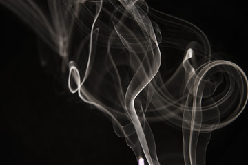 white smoke pattern on black background