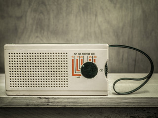 Vintage radio on wall background
