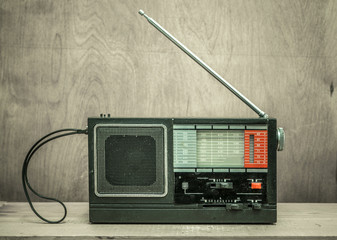 Vintage radio on wall background