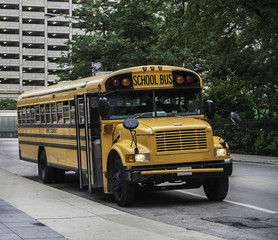 Fototapeta na wymiar American school bus parked in the streets of Chicago, USA.
