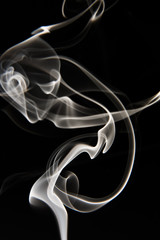 white smoke pattern on black background