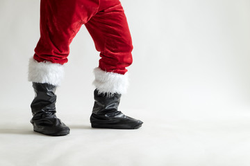 Legs of Santa claus on white background by Christmas concept