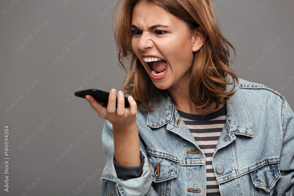 Poster Close up portrait of an angry stressed teenage girl