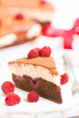 Chocolate cake with raspberries and cream