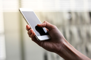 woman hand using cellphone outdoor