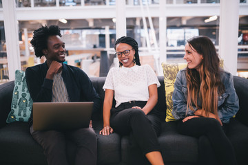 Group of mixed race businesspeople talking to each other in office