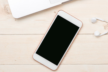 Smartphone mock up template on office deck.