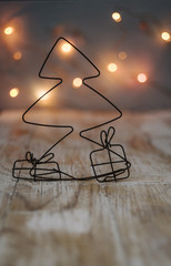 Christmas tree and gifts made of wire with Christmas lights