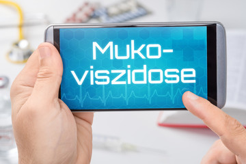 Smartphone mit dem Text Mukoviszidose auf dem Display